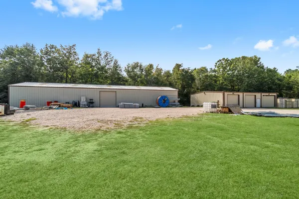 a view of house with outdoor space and sitting area