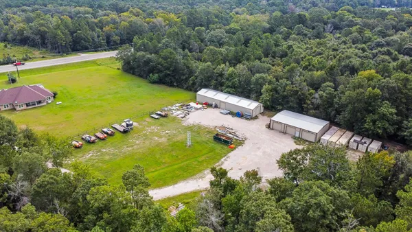 an aerial view of a house with a yard