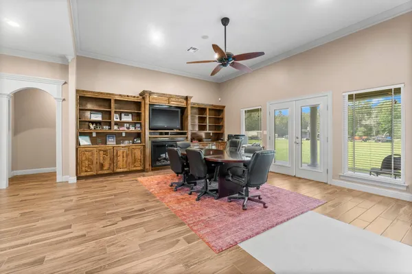 a view of a livingroom with furniture window and wooden floor