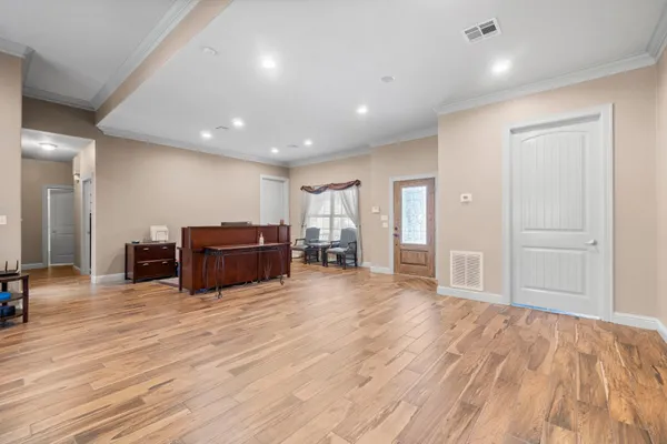a room with furniture and wooden floor