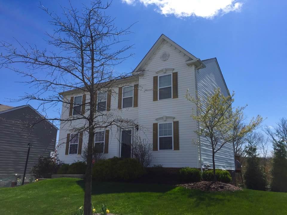 Lovely curb appeal to this home in a desired sidewalk community - and attractive landscaping with trees that are not too mature or need any trimming whatsoever!  