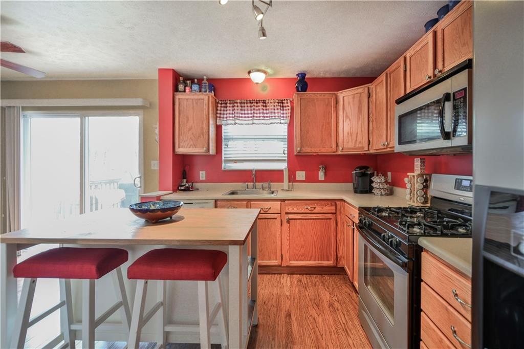 Stainless Appliances and updated polished chrome light fixture adds a modern touch.