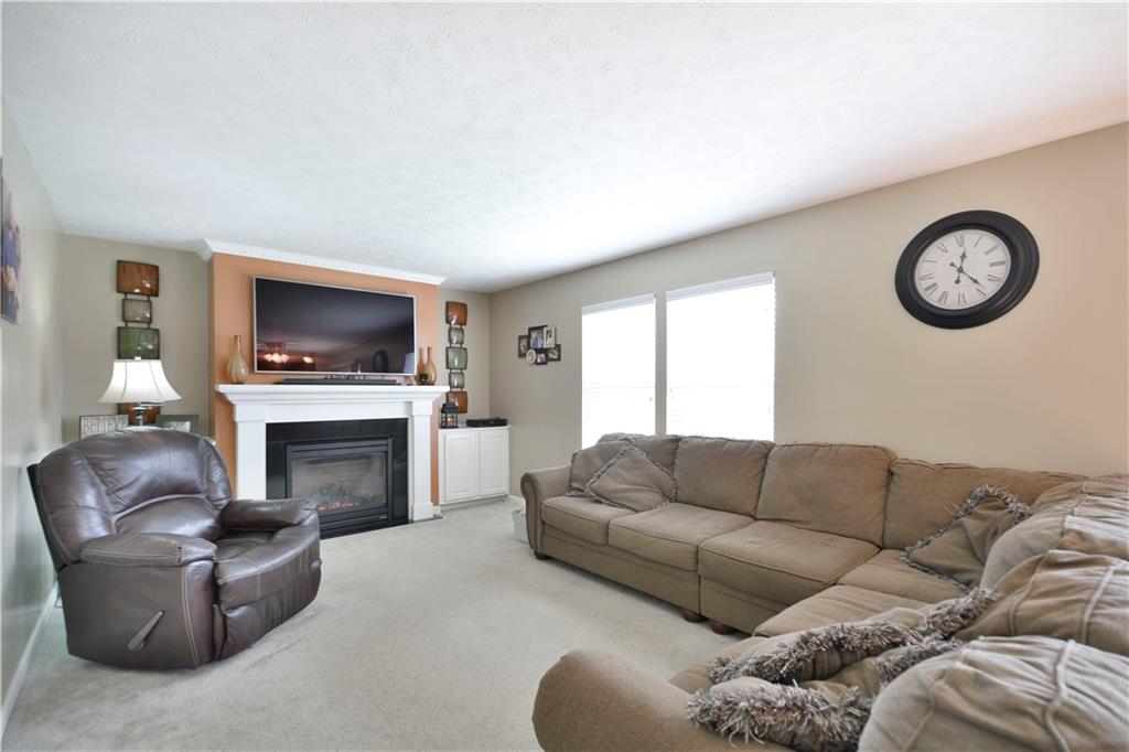 First Floor Family Room includes gas fireplace flanked by built in cabinetry.