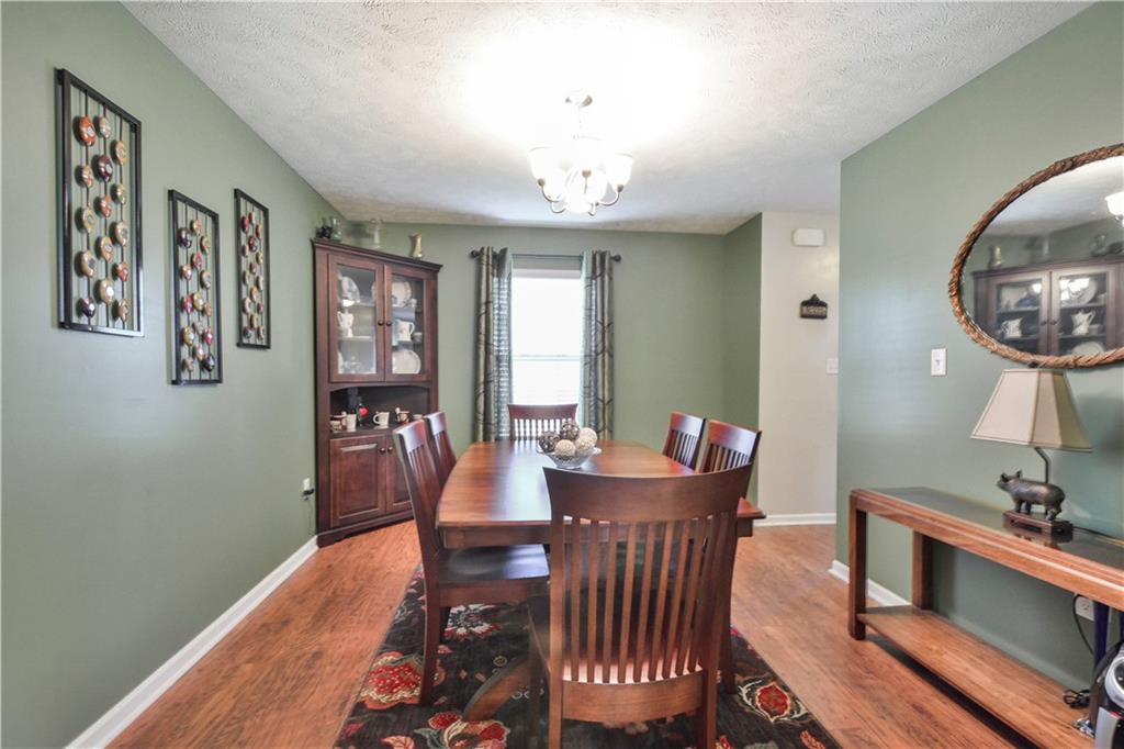 512 Blue Ridge Drive Coraopolis, PA 15108 - Photo 8 of 25 Dining Room with wood laminate flooring. Corner cupboard not included.