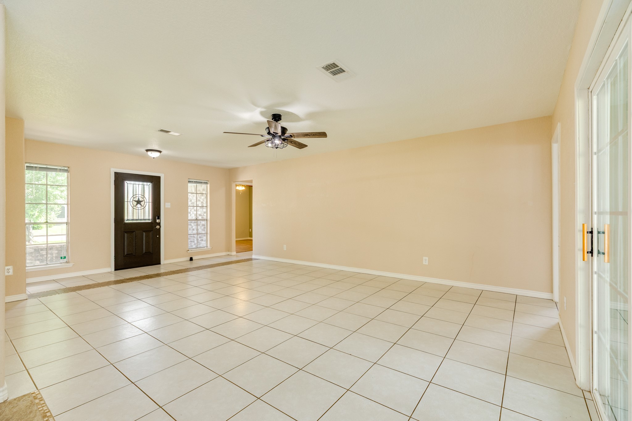 128 Houston Street Angleton, TX 77515 - Photo 14 of 25 a view of an empty room and window