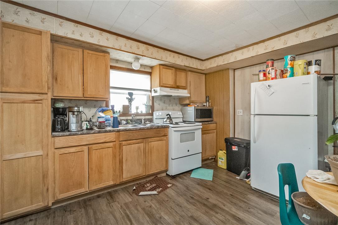 377 West Ridge Street Lansford, PA 18232 - Photo 7 of 39 The kitchen offers ample storage with light wood cabinetry and resilient wood-look flooring.