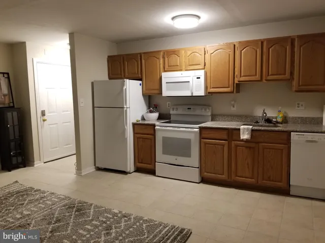 a room with a bed and a television