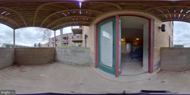 a view of swimming pool with a yard and seating space