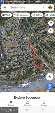 a living room with stainless steel appliances kitchen island a stove and a refrigerator