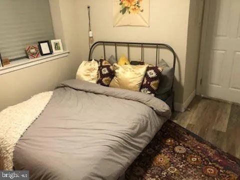 a bedroom with a bed and chair