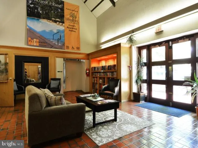 a living room with furniture and flat screen tv