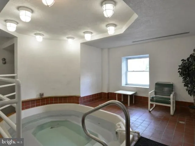 a white toilet sitting next to a bathroom sink