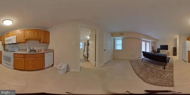 a white toilet sitting next to a bathroom sink