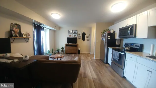a bathroom with a shower curtain and a window
