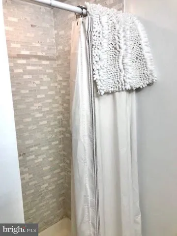 a bathroom with a sink toilet and a mirror