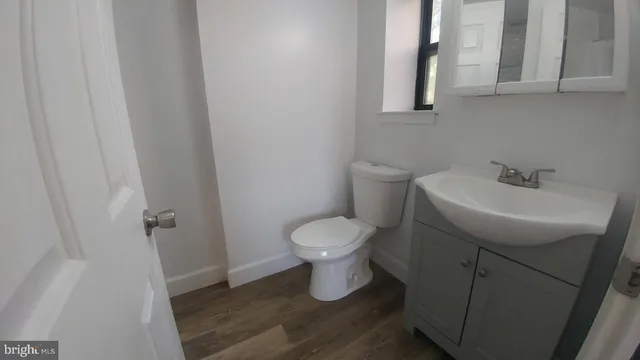a living room with furniture a dining table and a fireplace