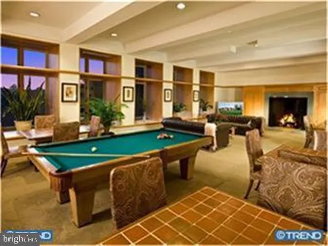 a view of a garden with flowers and trees