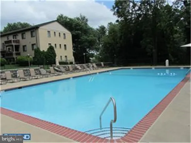 a view of an empty room with a glass door