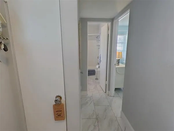 a bathroom with a granite countertop toilet and a shower