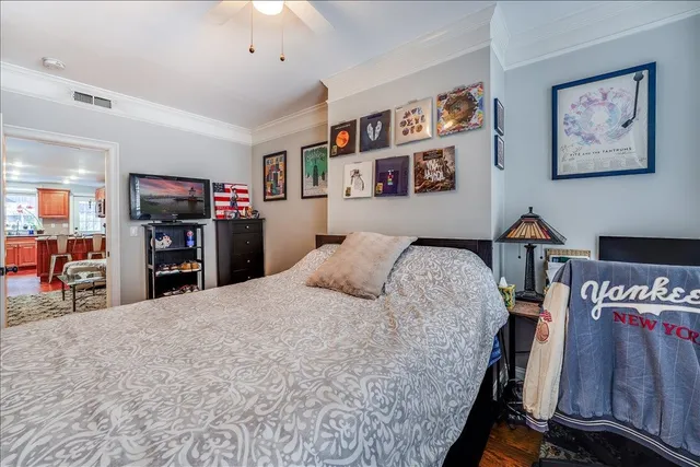 a bed room with a large bed and a tv