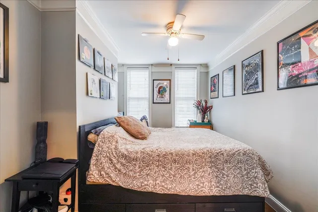 a bedroom with a bed and dresser
