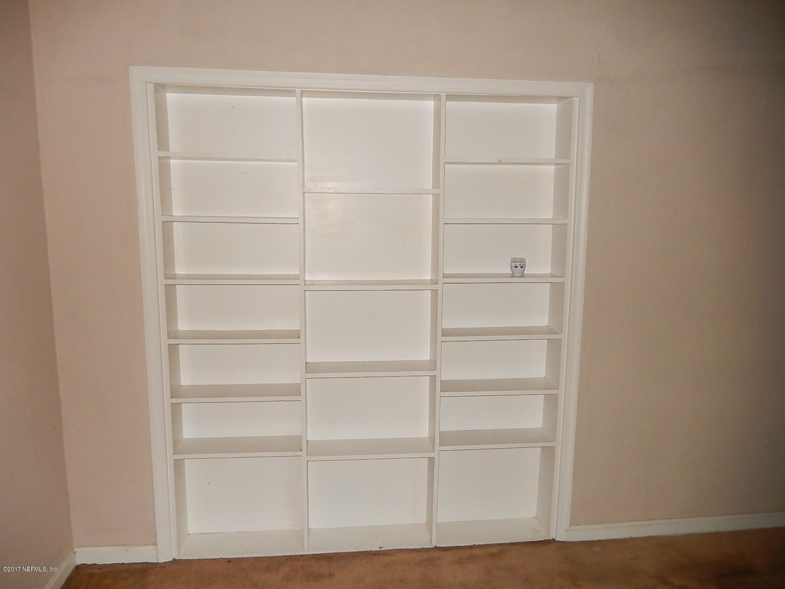 3272 Peoria Road Orange Park, FL 32065 - Photo 7 of 36 built-in bookshelf - living room