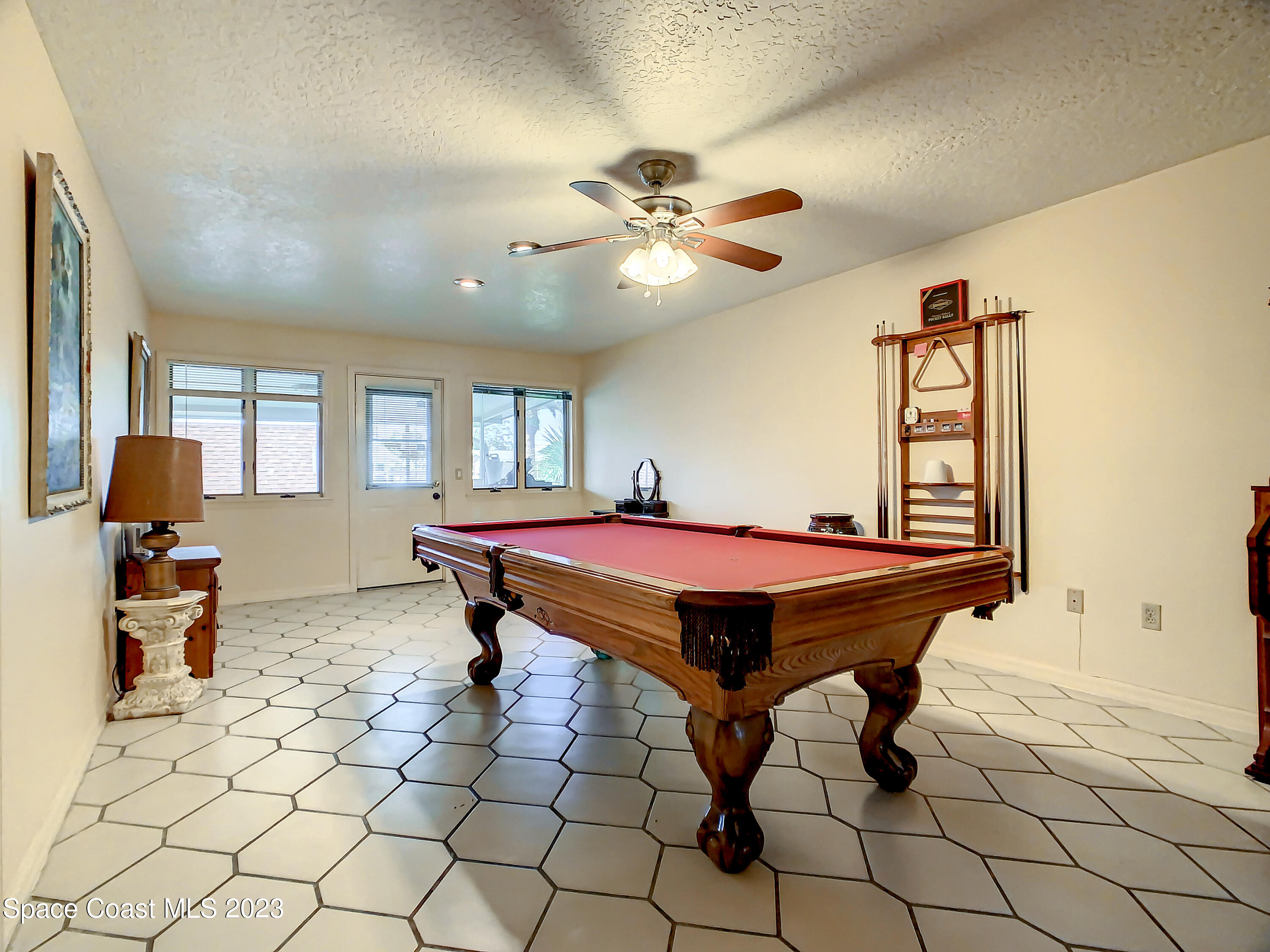 1675 East Riviera Drive Merritt Island, FL 32952 - Photo 26 of 50 a room with pool table and windows