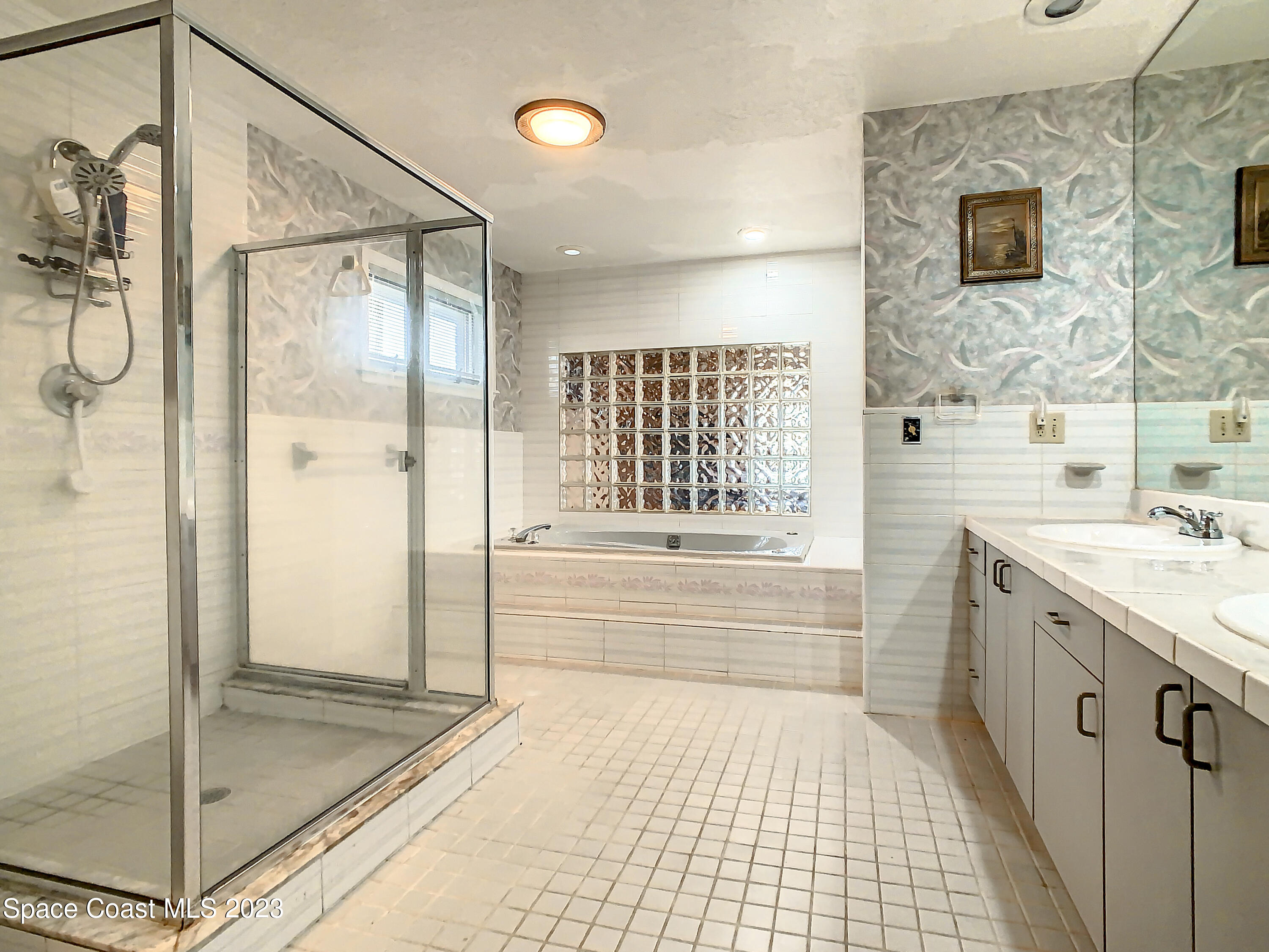 1675 East Riviera Drive Merritt Island, FL 32952 - Photo 30 of 50 a bathroom with a shower and a bathtub