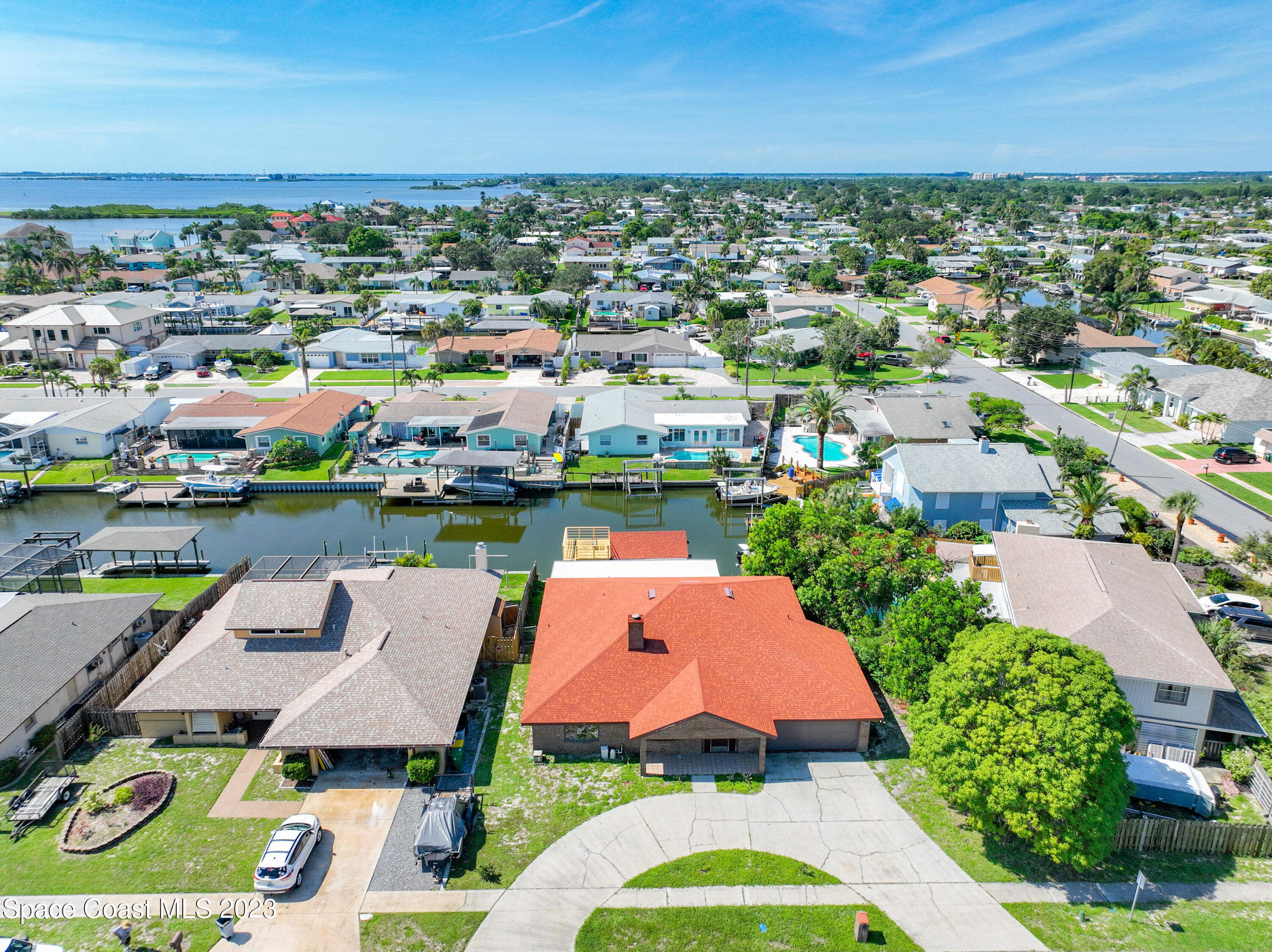 1675 East Riviera Drive Merritt Island, FL 32952 - Photo 3 of 50 an aerial view of residential houses with outdoor space and street view