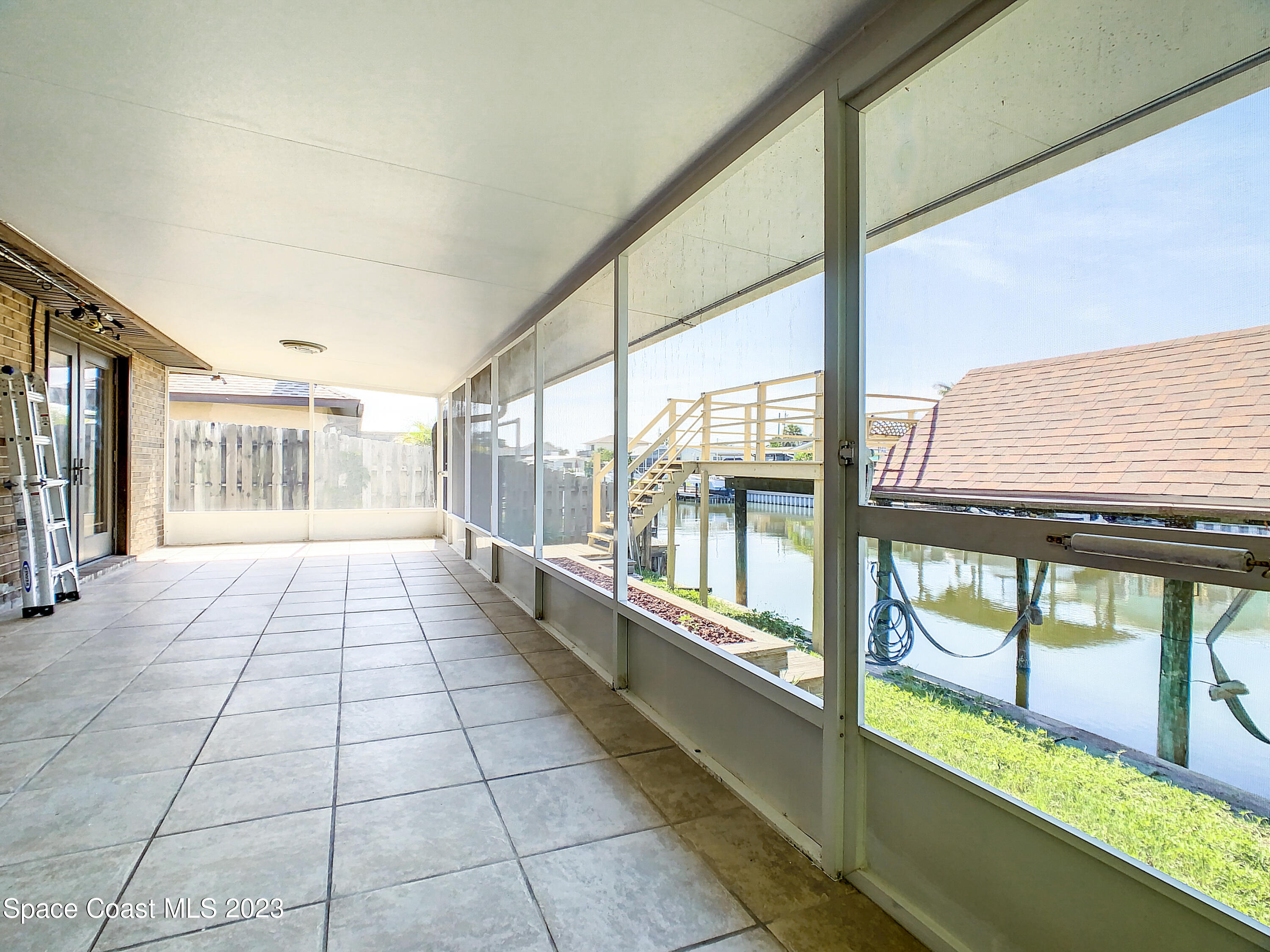 1675 East Riviera Drive Merritt Island, FL 32952 - Photo 35 of 50 a view of a room with large windows
