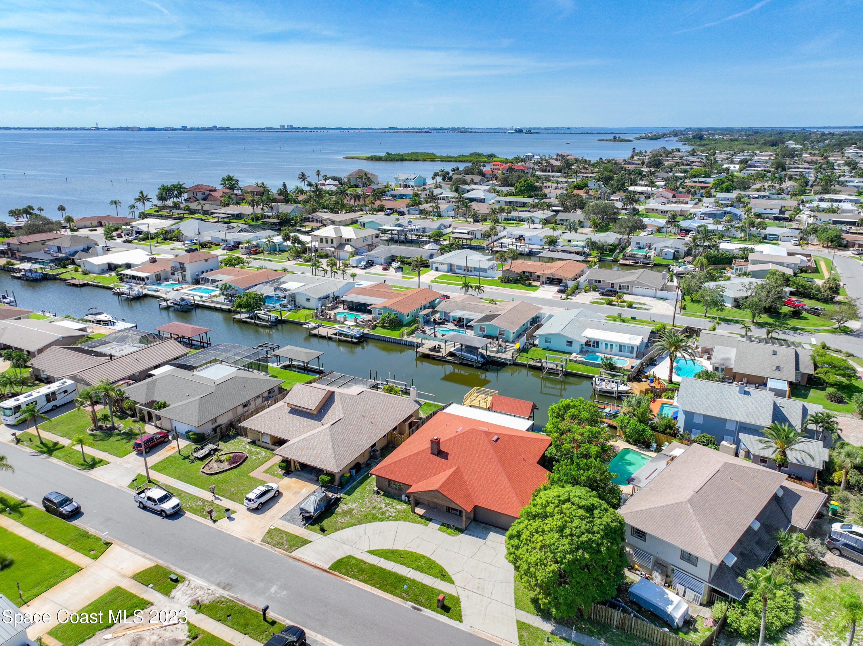 1675 East Riviera Drive Merritt Island, FL 32952 - Photo 4 of 50 an aerial view of a houses with a lake view