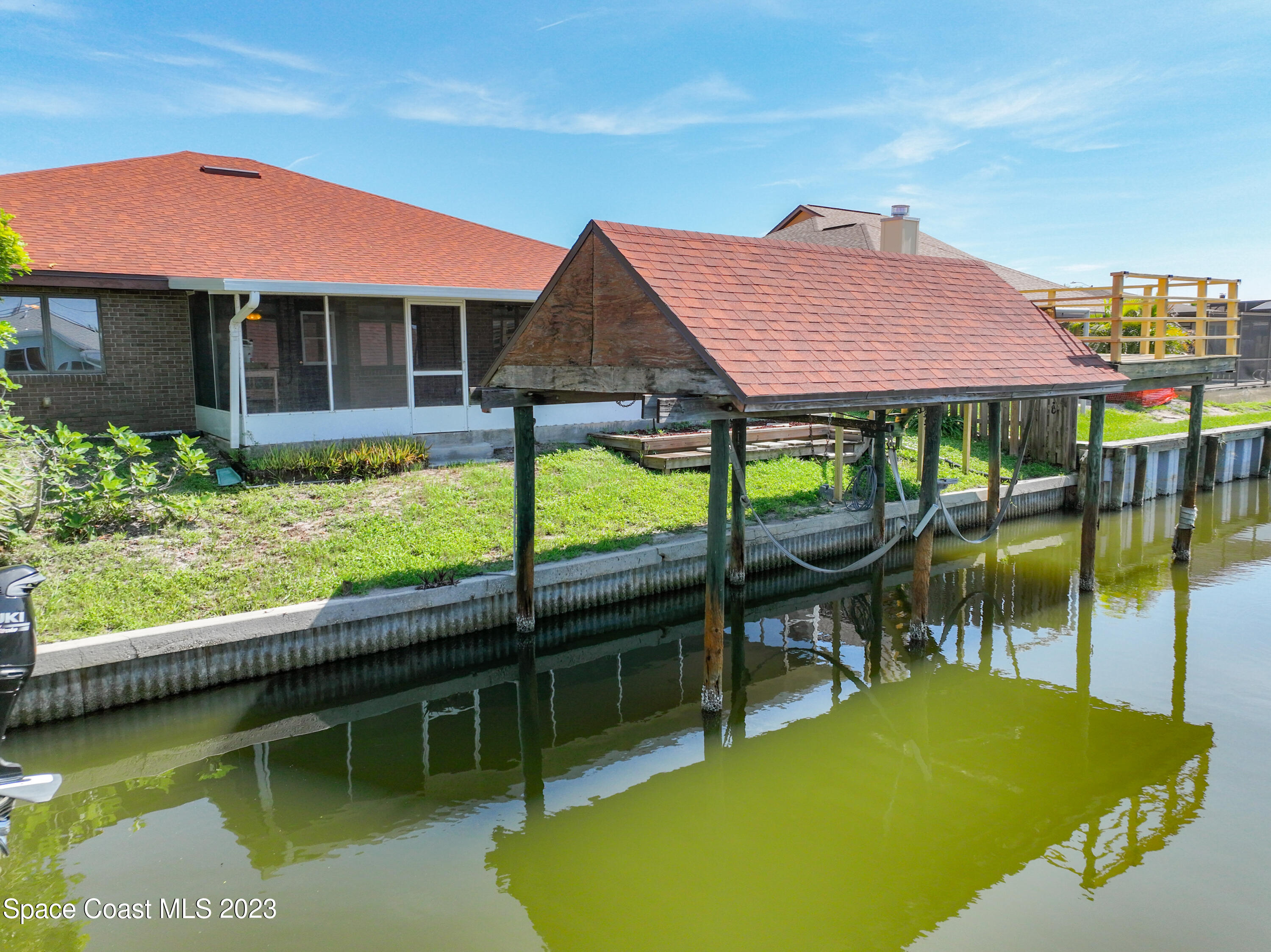 1675 East Riviera Drive Merritt Island, FL 32952 - Photo 41 of 50 a view of a house with pool and a yard