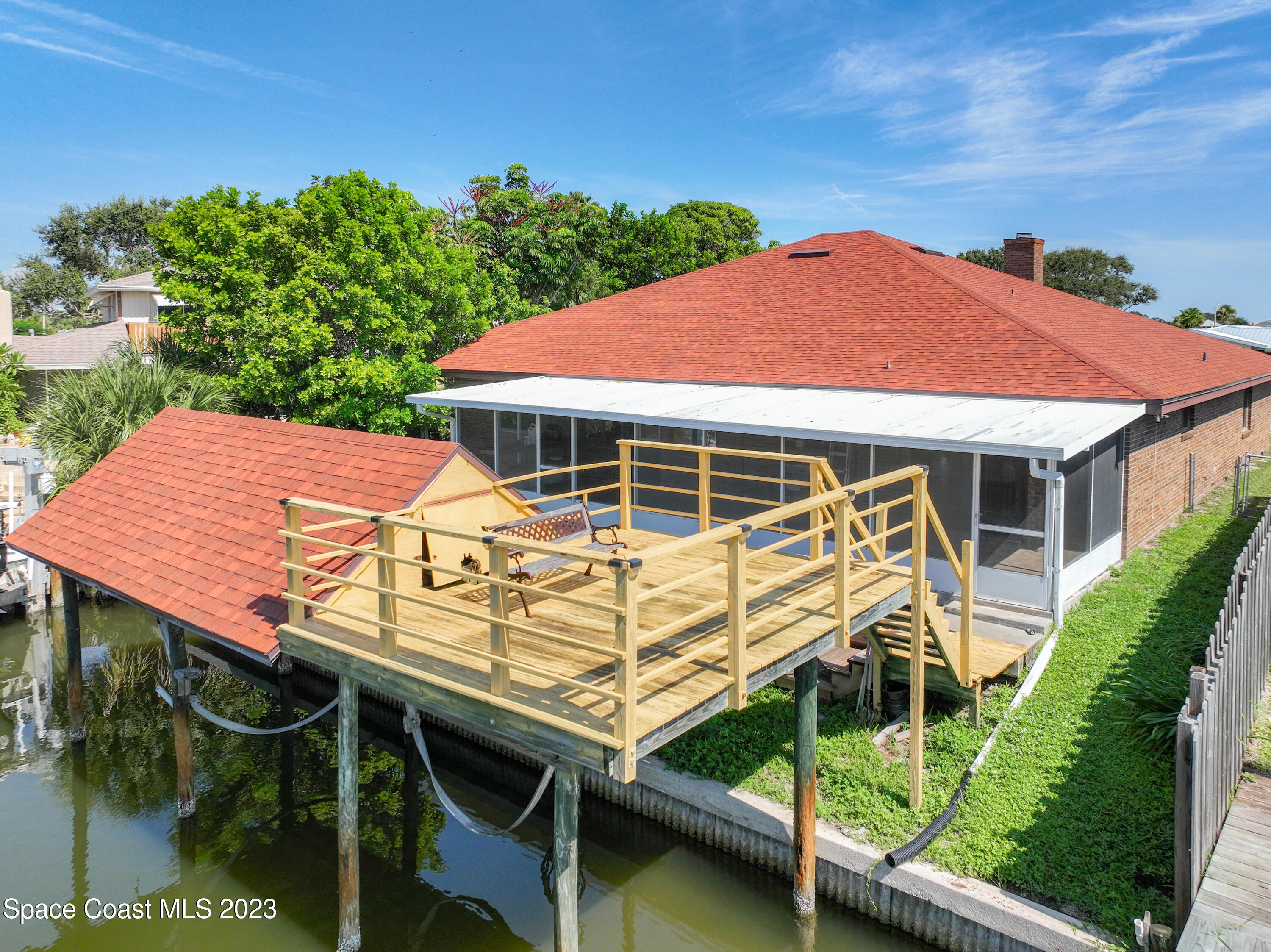 1675 East Riviera Drive Merritt Island, FL 32952 - Photo 44 of 50 a aerial view of a house with table and chairs