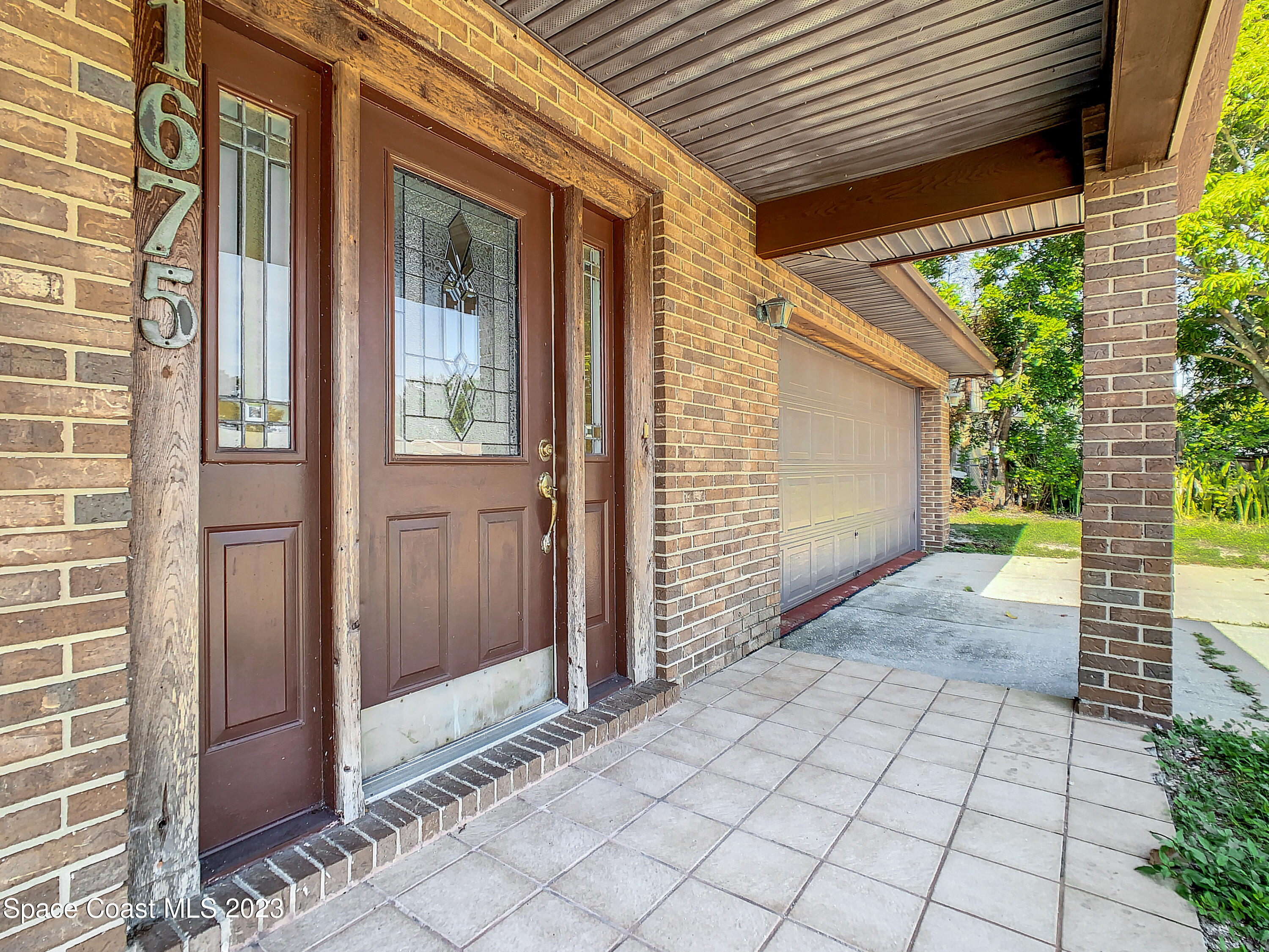 1675 East Riviera Drive Merritt Island, FL 32952 - Photo 6 of 50 a view of front door of house