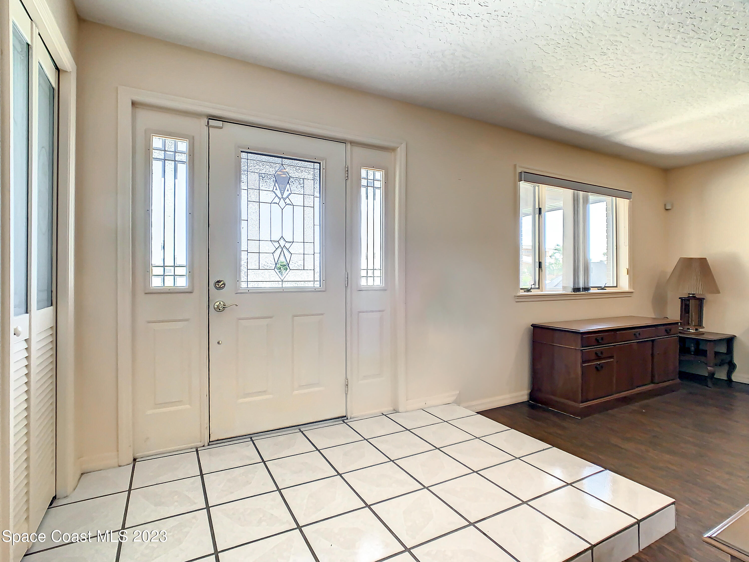 1675 East Riviera Drive Merritt Island, FL 32952 - Photo 7 of 50 a room with a bed and window