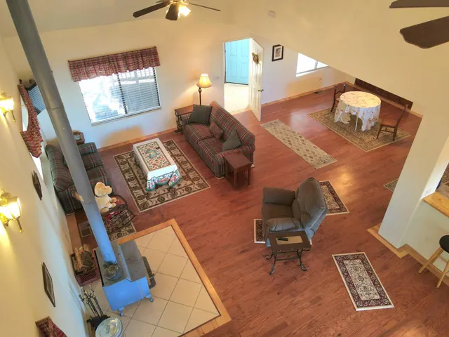 a workspace with furniture hardwood and a window