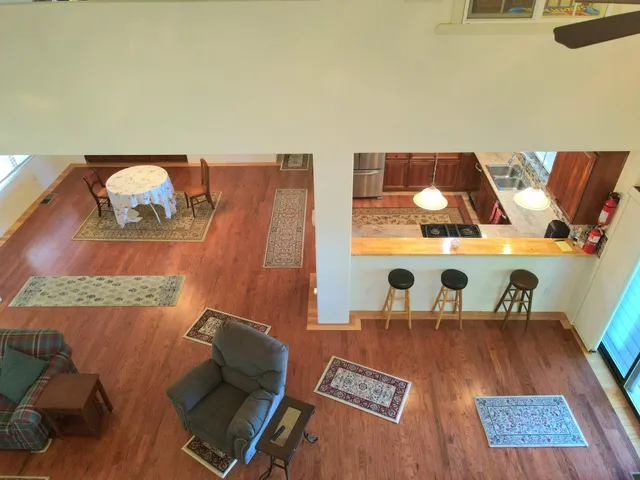 a kitchen with stainless steel appliances granite countertop a refrigerator and a stove