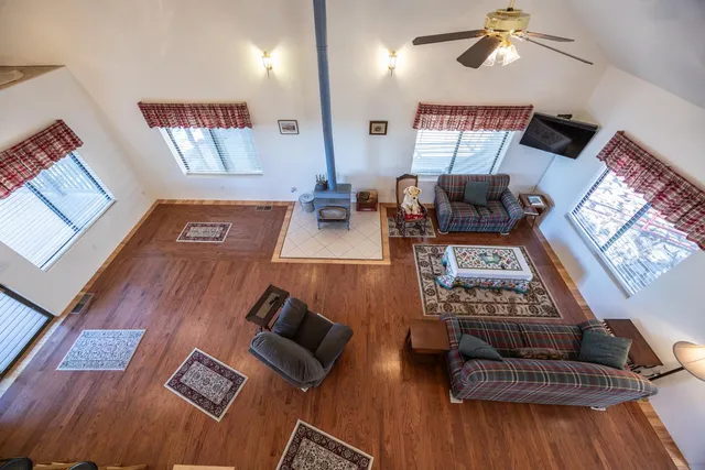 a bedroom with furniture and wooden floor