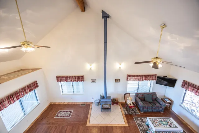a spacious bathroom with a sink a mirror and a shower