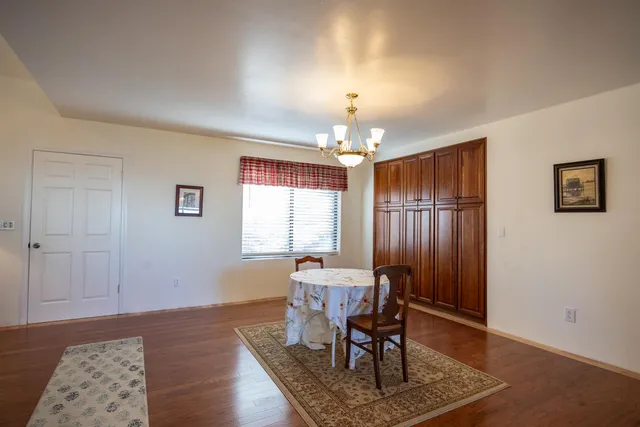 a utility room with a sink a cabinetry and a washer dryer