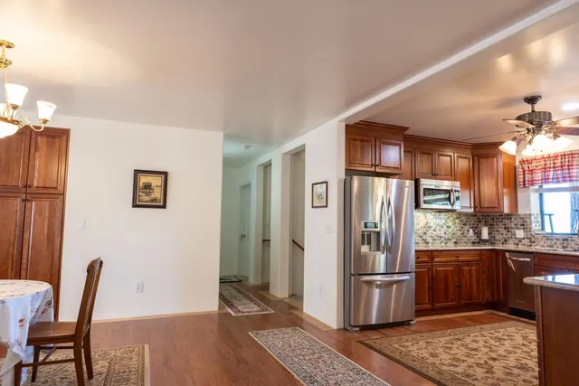 a room with furniture and a ceiling fan