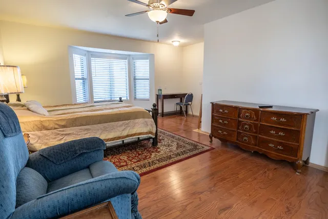 a bathroom with a sink toilet vanity shower and shower