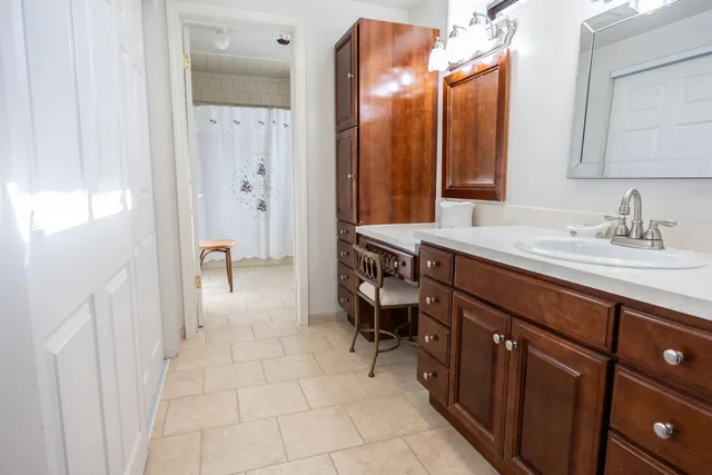 a living room with furniture and a walk in closet