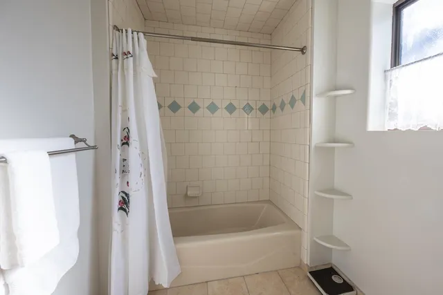 a kitchen with stainless steel appliances granite countertop a stove microwave and cabinets