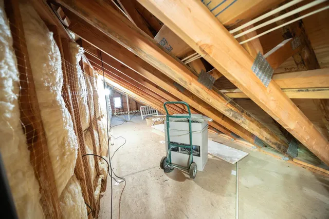 a view of house with a tree next to a road