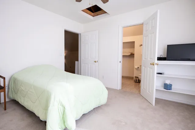 a view of a house with a tree