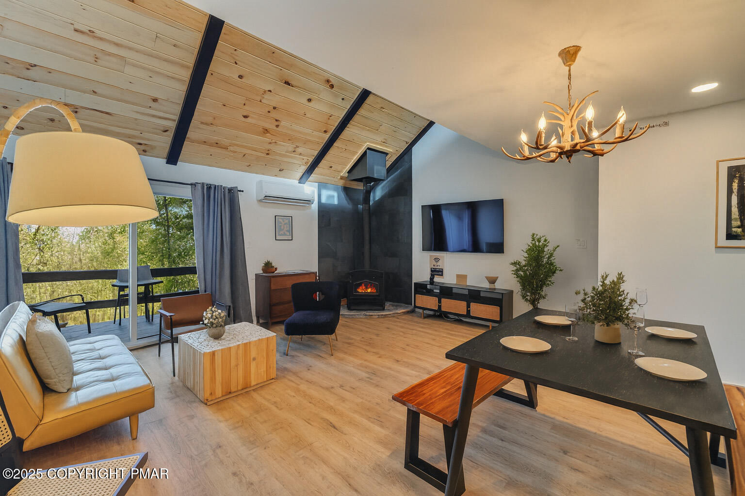 4 Middle Village Way Tannersville, PA 18372 - Photo 3 of 36 a living room with furniture a chandelier and a flat screen tv