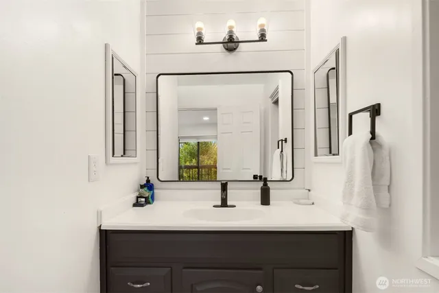 a bathroom with a sink and a mirror