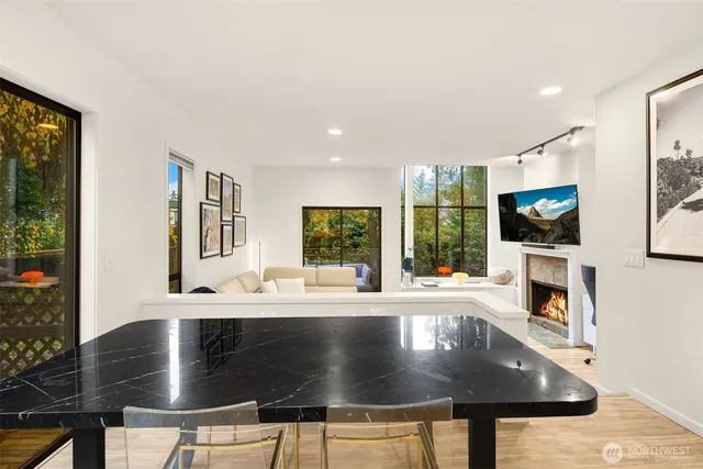 a kitchen with stainless steel appliances granite countertop a sink a stove and a microwave