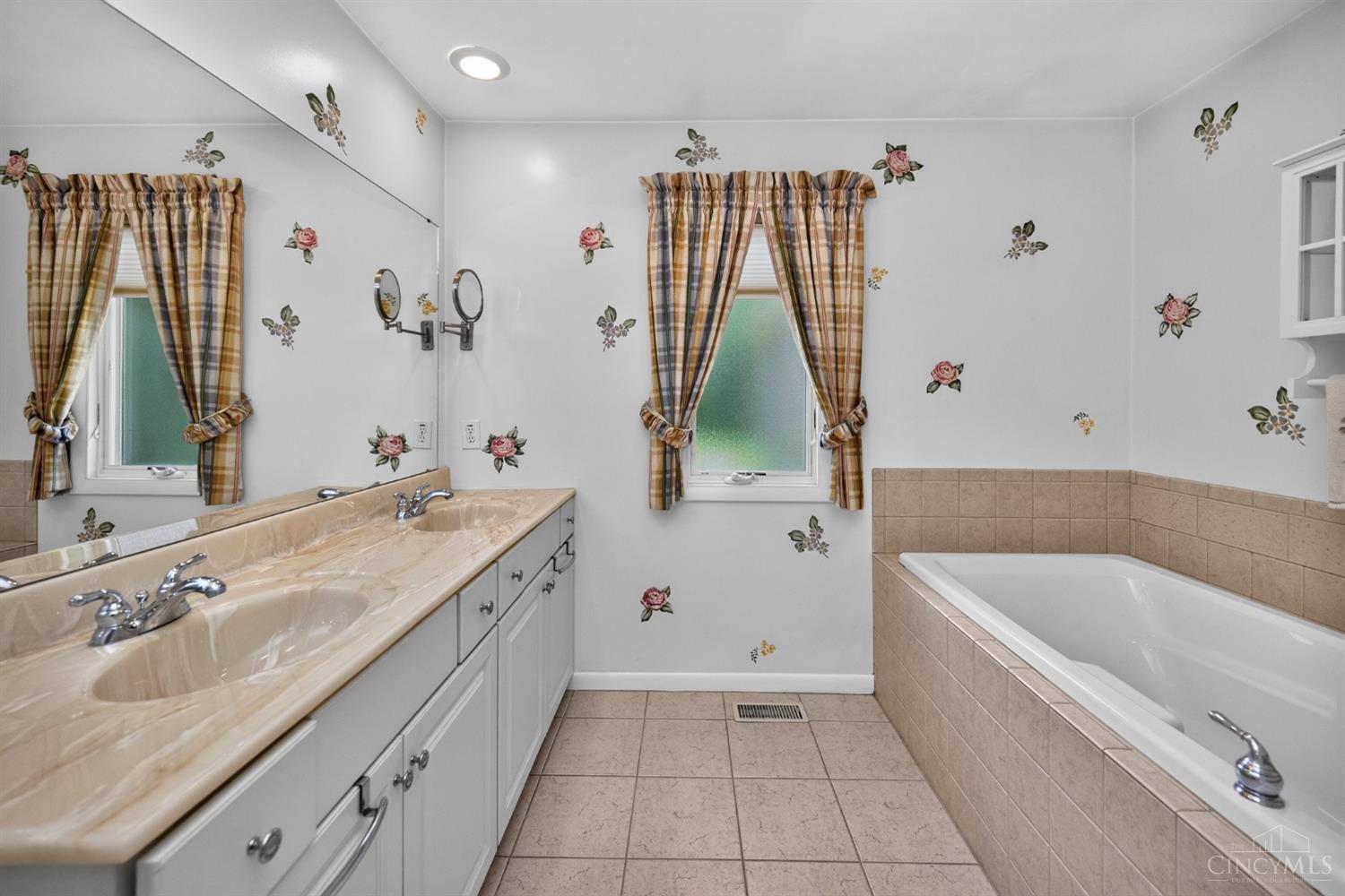 3078 Ebenezer Road Cincinnati, OH 45233 - Photo 25 of 51 The primary full bath features a double vanity, soaking tub and separate shower.